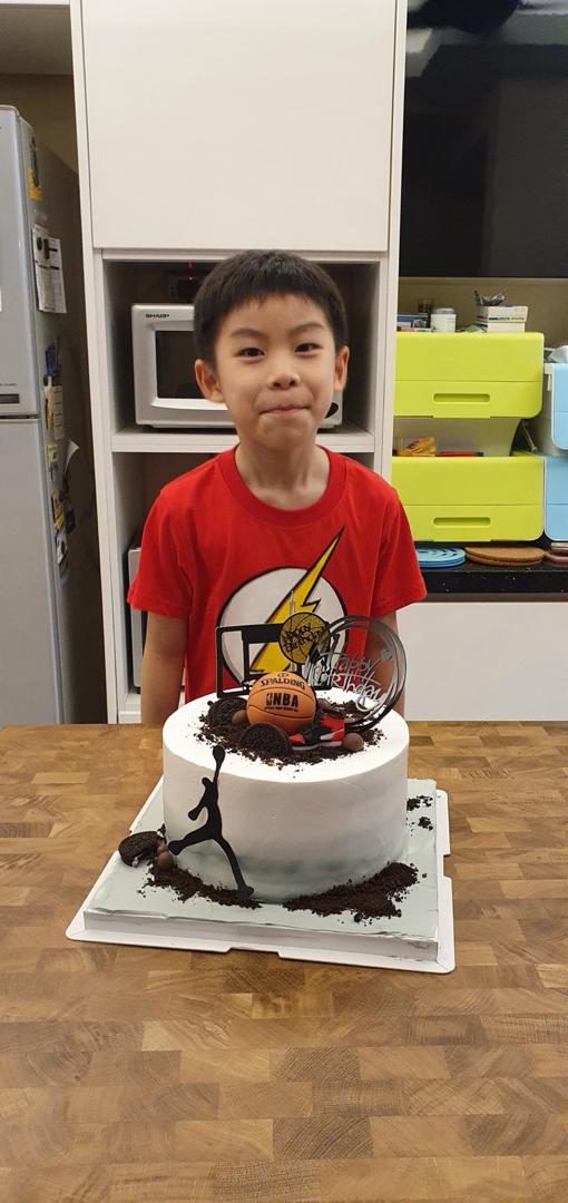 Wei Heng with a basketball-themed birthday cake